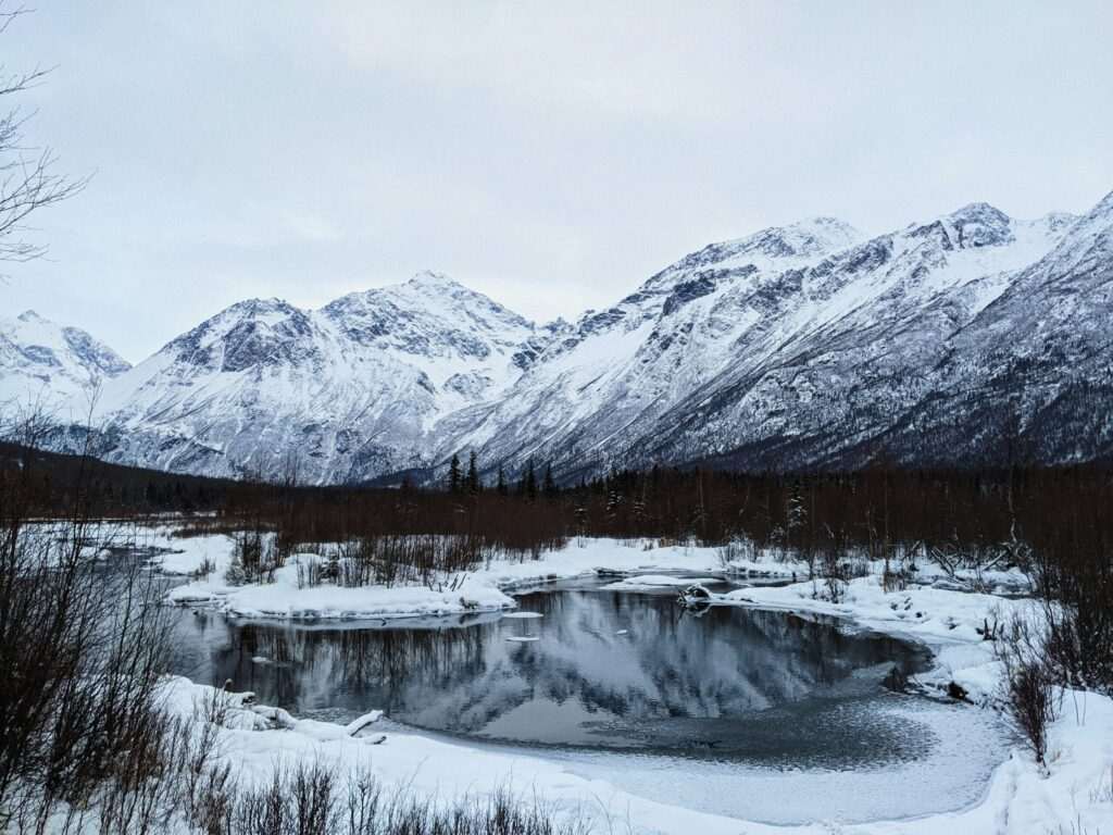 Snowy mountain and water scene near Anchorage, Alaska in winter
