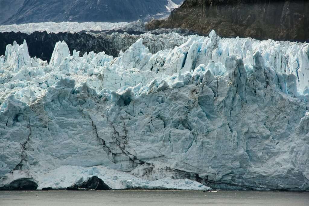 A massive Alaska glacier with rugged blue ice formations