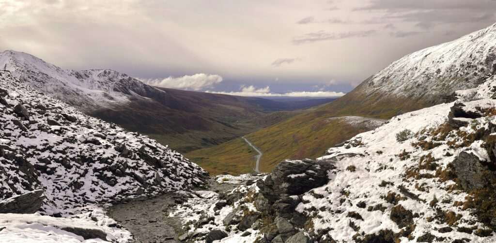 Winding road and snowy mountains near Hatcher Pass, Alaska