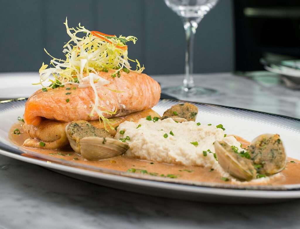 Seafood plate with salmon, clams, and mashed potatoes