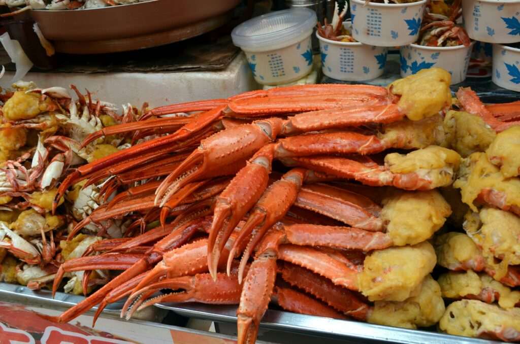 Cooked king crab legs at a seafood market