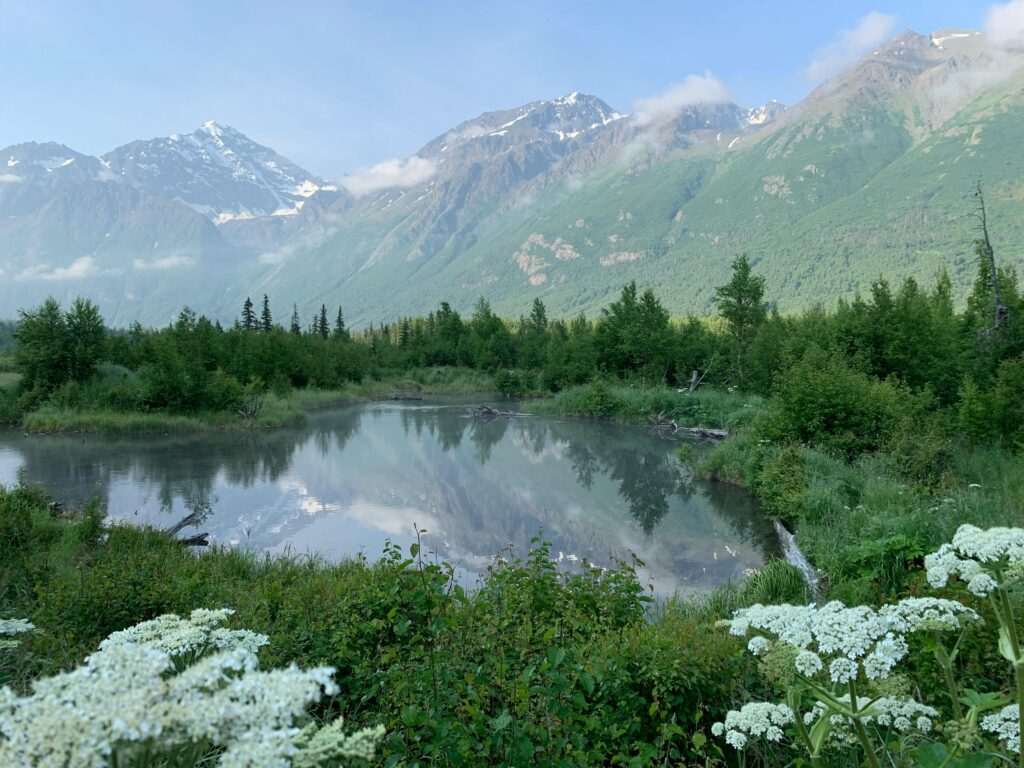 Mountain landscape near Anchorage, Alaska with a calm lake and green trees