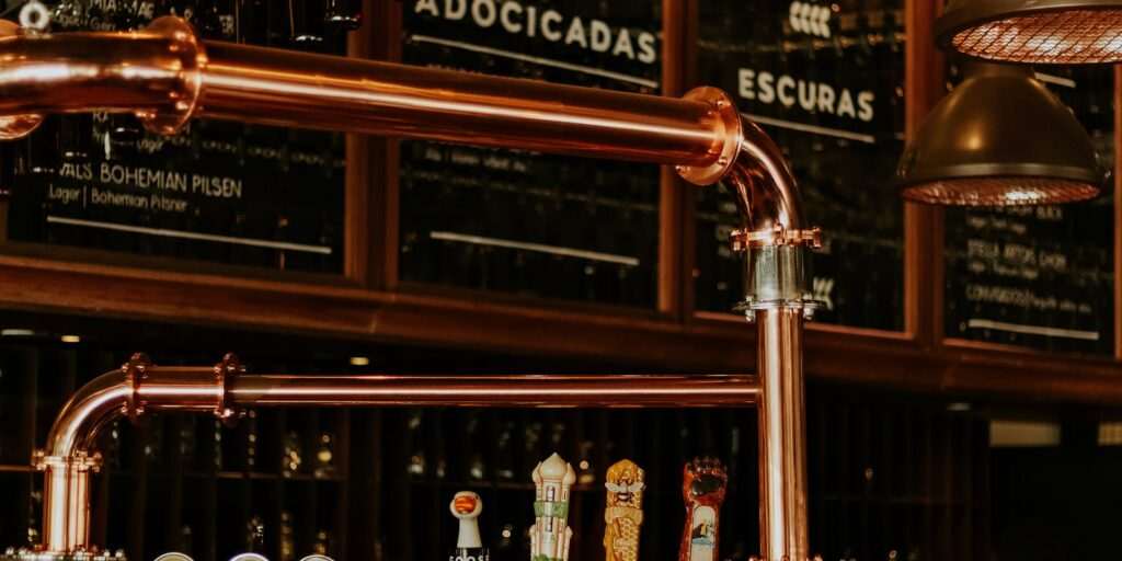49th State Brewing Company brewery interior with copper taps and bar